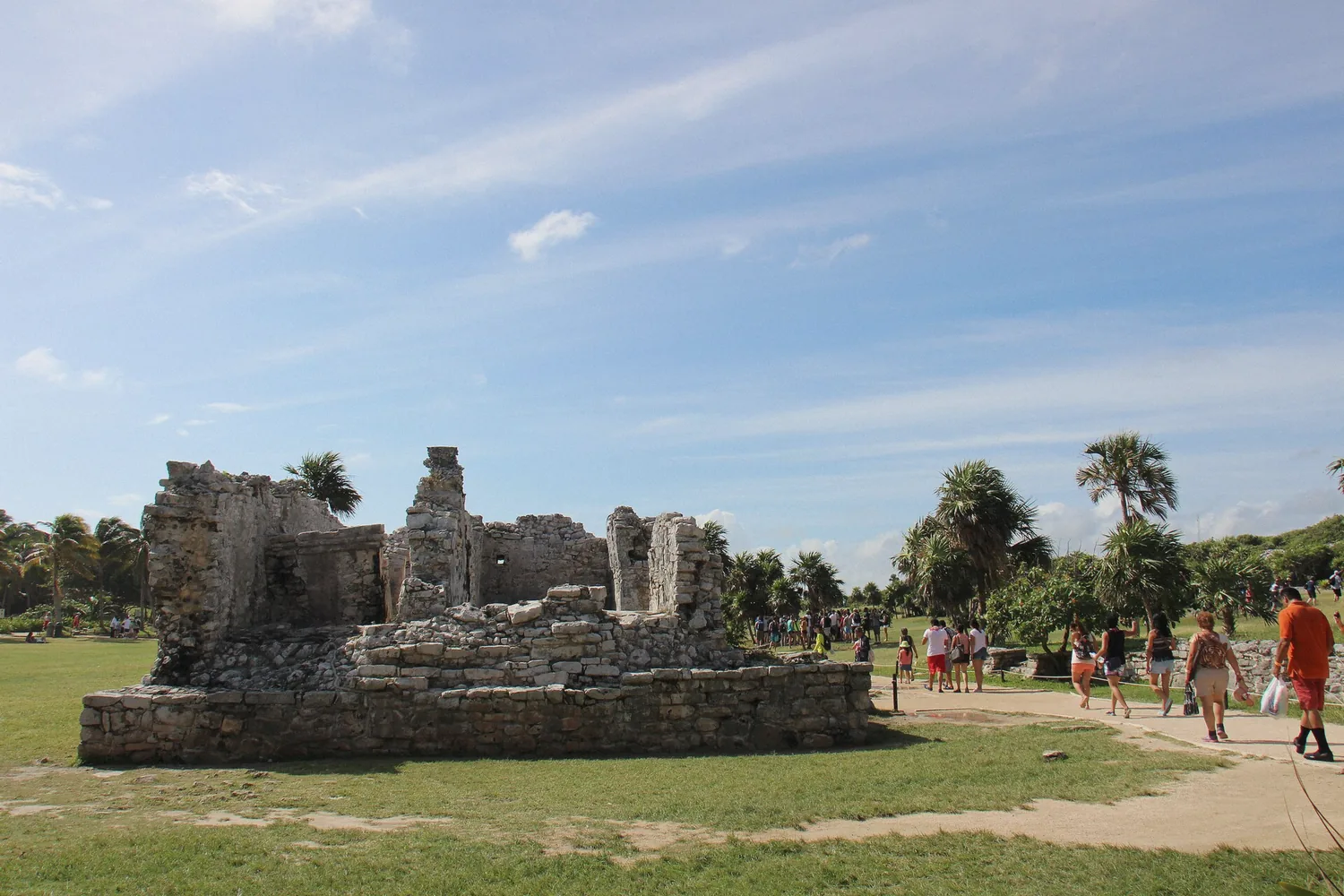 Maya ruins on the cliff at Tulum archaeological site on a Riviera Maya day trip, Mexico