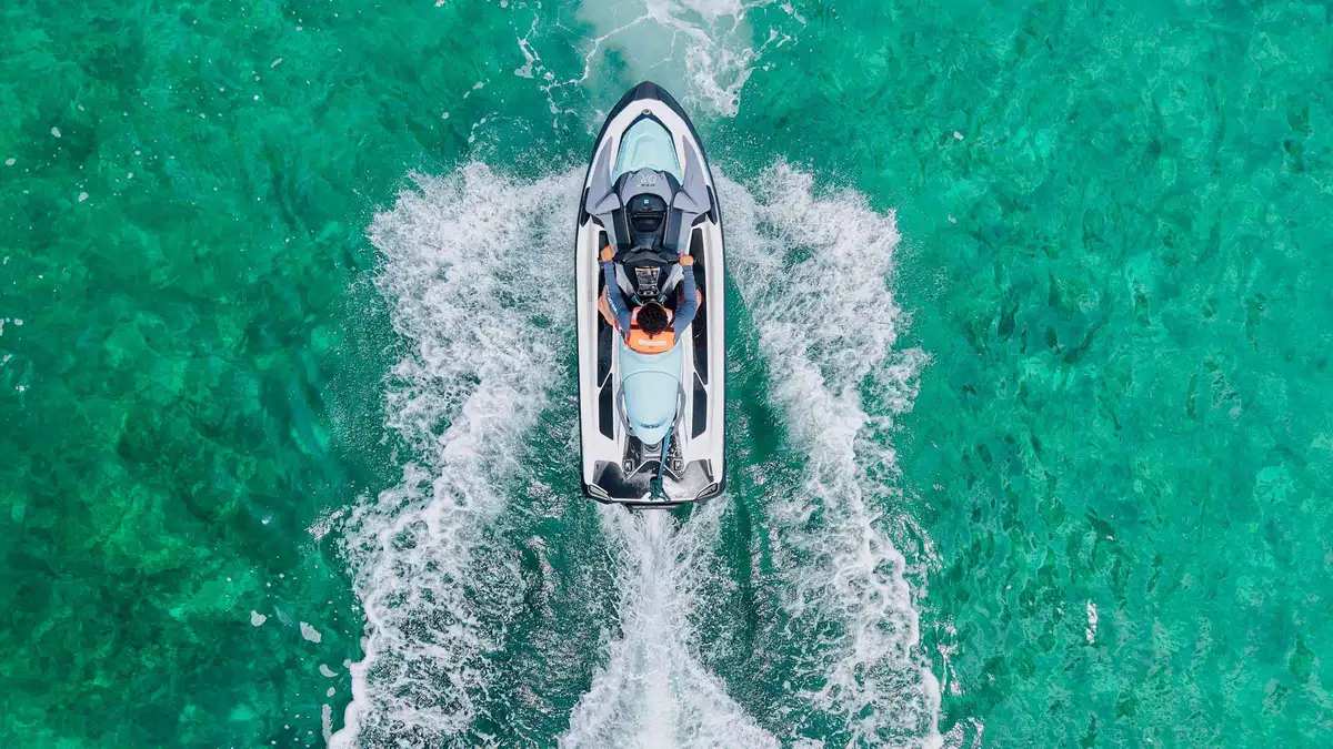 Rider on a jet ski in the turquoise lagoon on the Cancun jet ski and snorkel adventure, Mexico